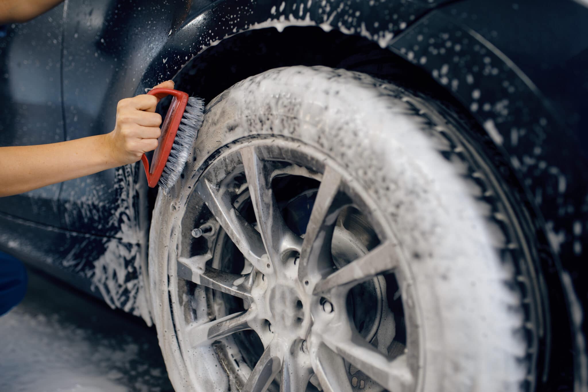 cleaning wheels with soap and brush